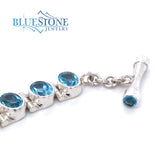 Sterling Silver Bracelet w/ 16 Blue Topazes -7.5"